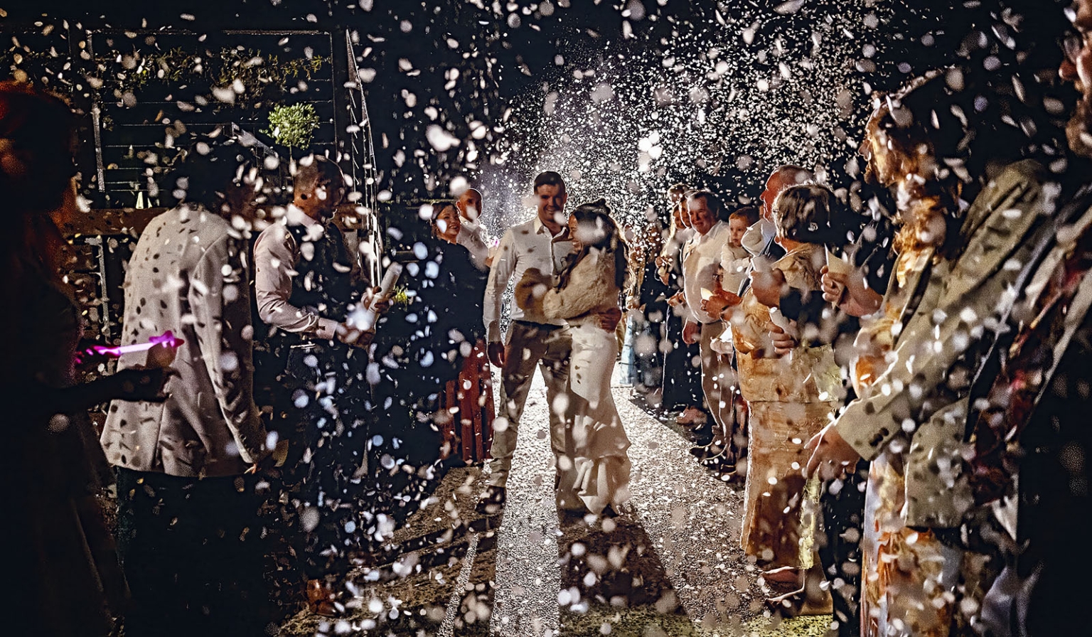 the lane vineyard wedding - caitlyn & craig 134 Wedding celebration with happy newlyweds, confetti, and joyous guests capturing the moment.