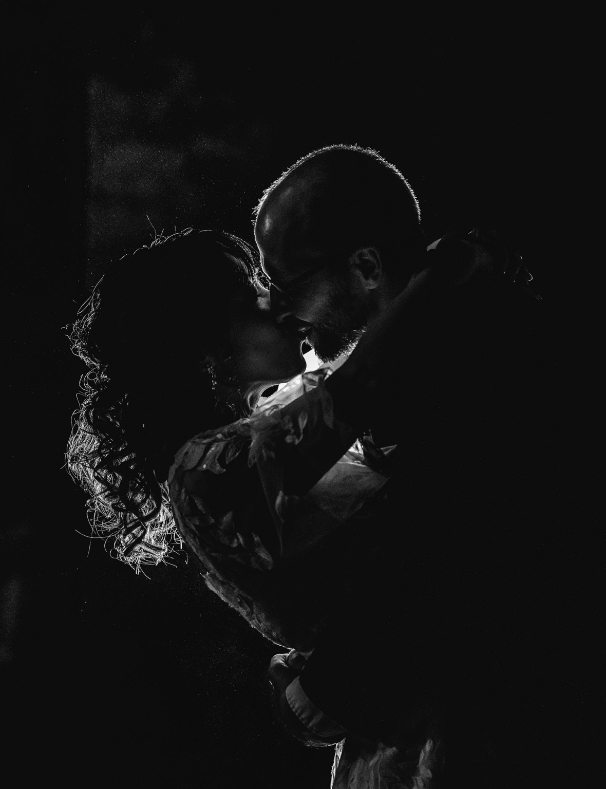 adelaide hills wedding at the manor - jo & dan 78 Romantic couple kissing in dramatic black and white silhouette portrait.