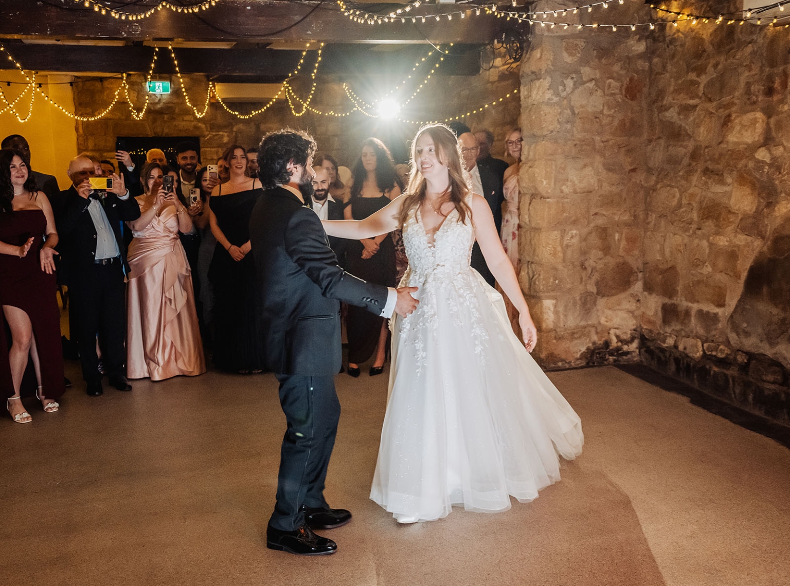 beautiful manor basket range wedding - sophie & theodore 145 Bride and groom share first dance at rustic wedding reception.
