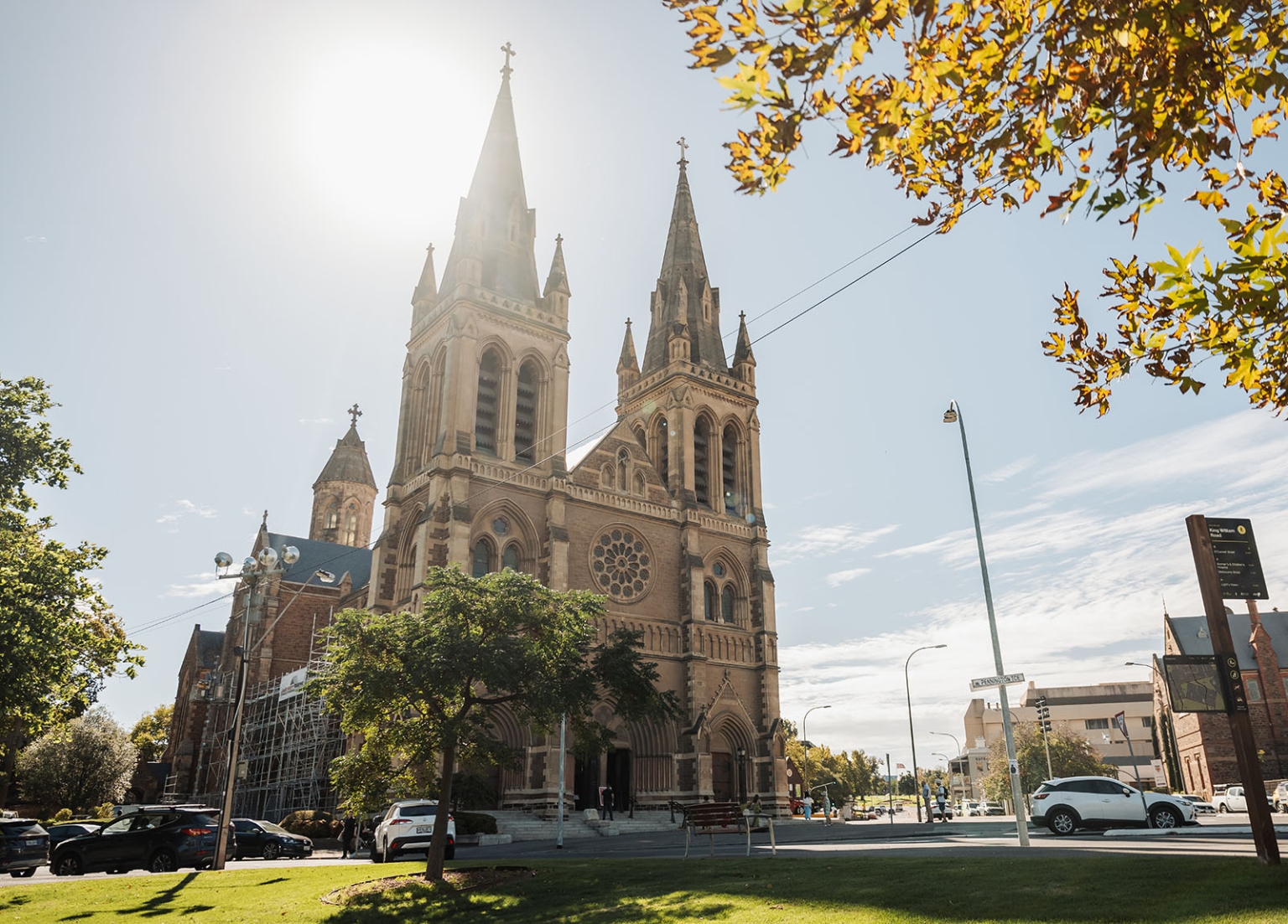 adelaide's st peter's cathedral wedding - irish & nick 1 St Peters Cathedral Adelaide with Gothic spires on a sunny urban street.