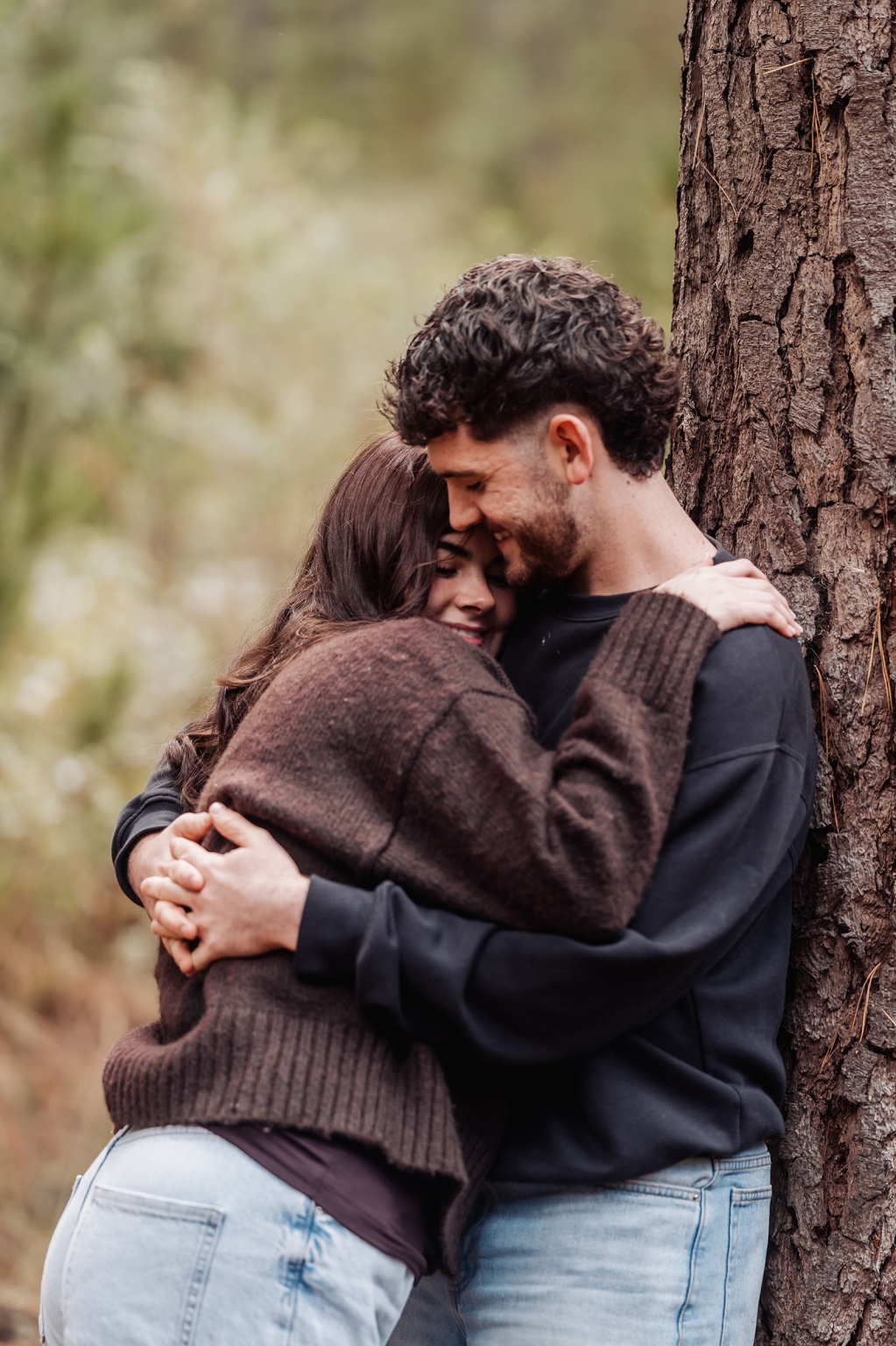 cabn at kuitpo forest proposal - tamsyn & blake 12 Couple embracing tenderly in serene forest setting, showcasing love and tranquility.
