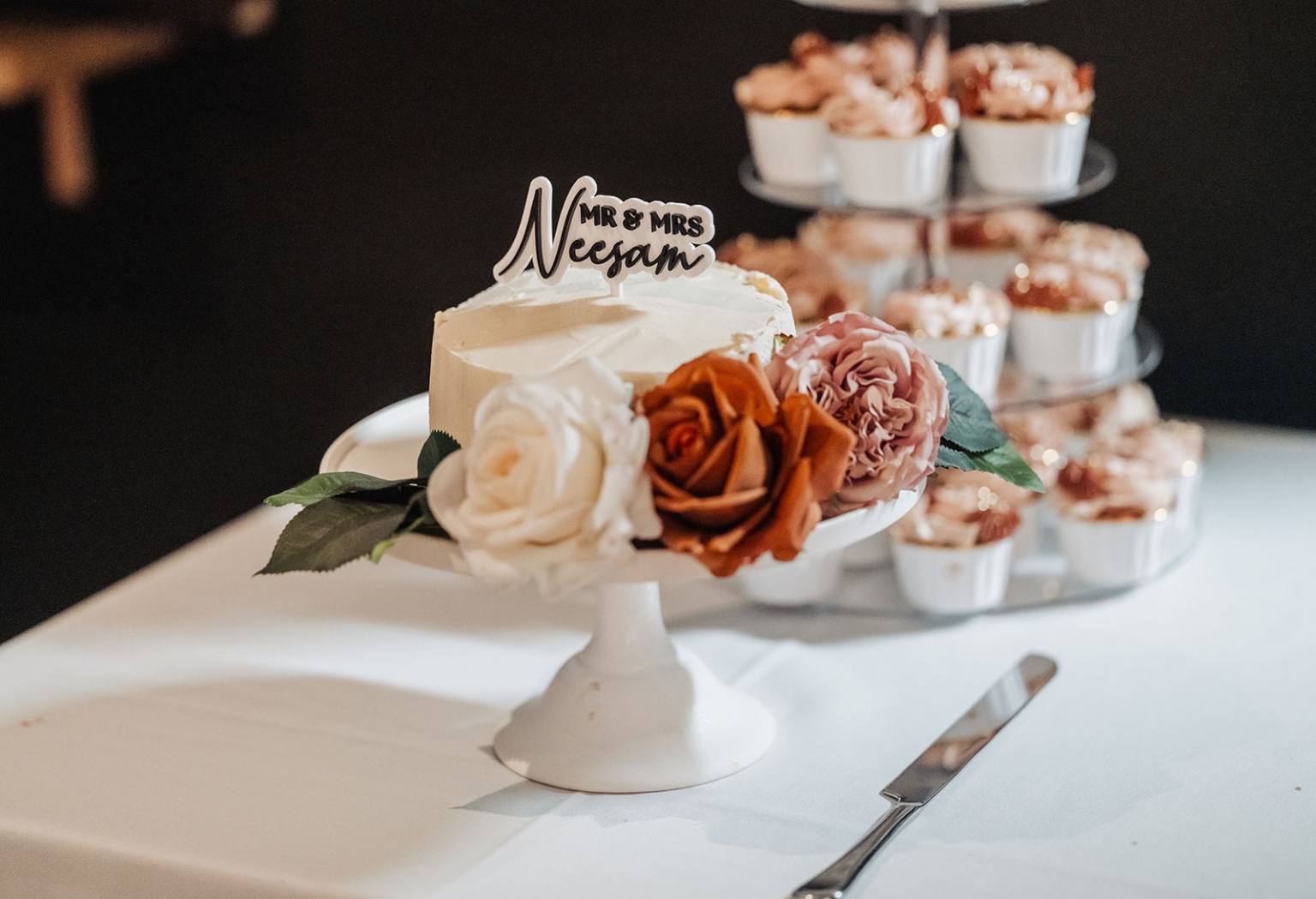 the lane vineyard wedding - caitlyn & craig 130 Elegant wedding cake table with minimalistic design and floral-decorated cake.