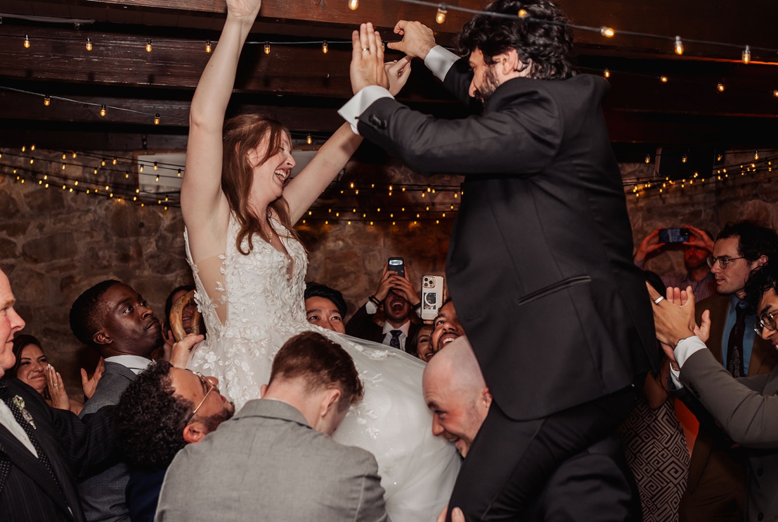 beautiful manor basket range wedding - sophie & theodore 149 Bride and groom lifted during joyful wedding chair dance reception.
