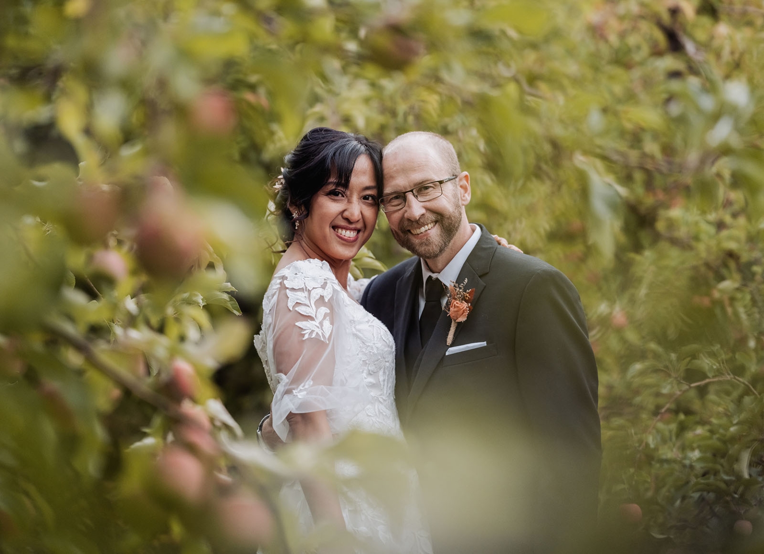 adelaide hills wedding at the manor - jo & dan 53 Bride and groom garden wedding portrait surrounded by lush greenery.