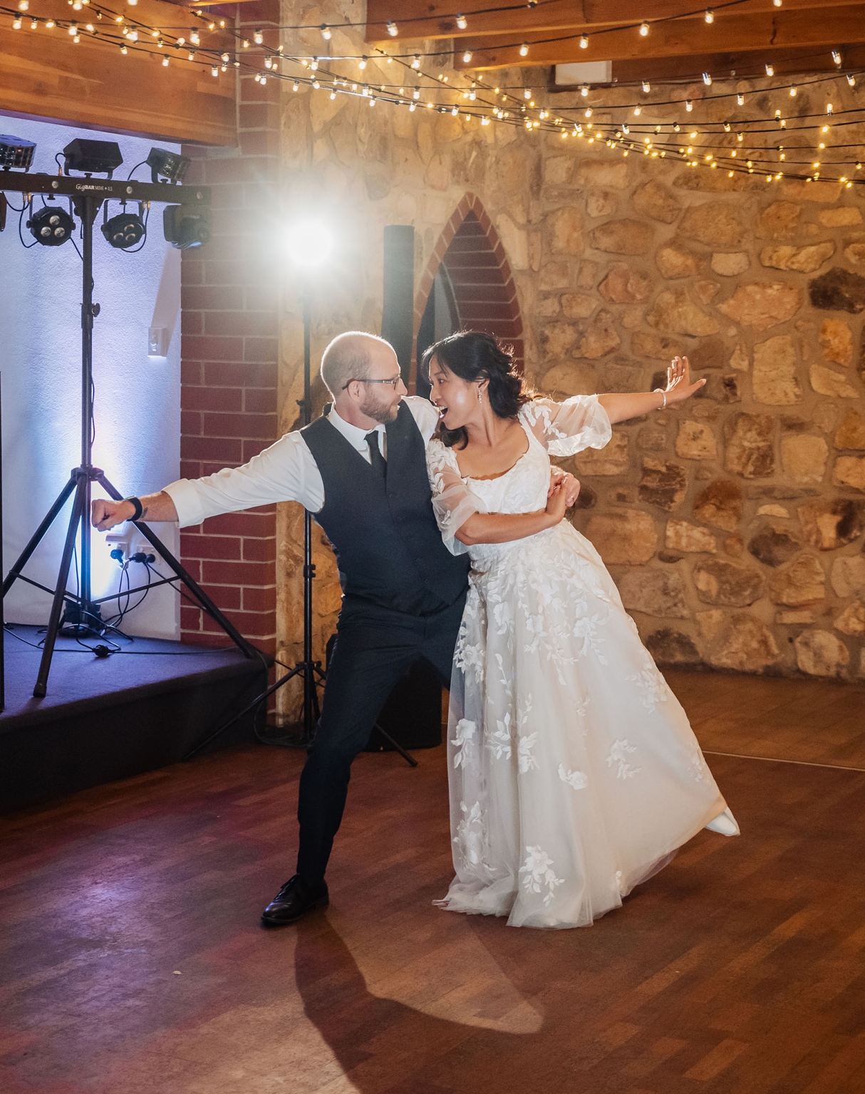 adelaide hills wedding at the manor - jo & dan 70 Bride and groom wedding dance at rustic reception with string lights.