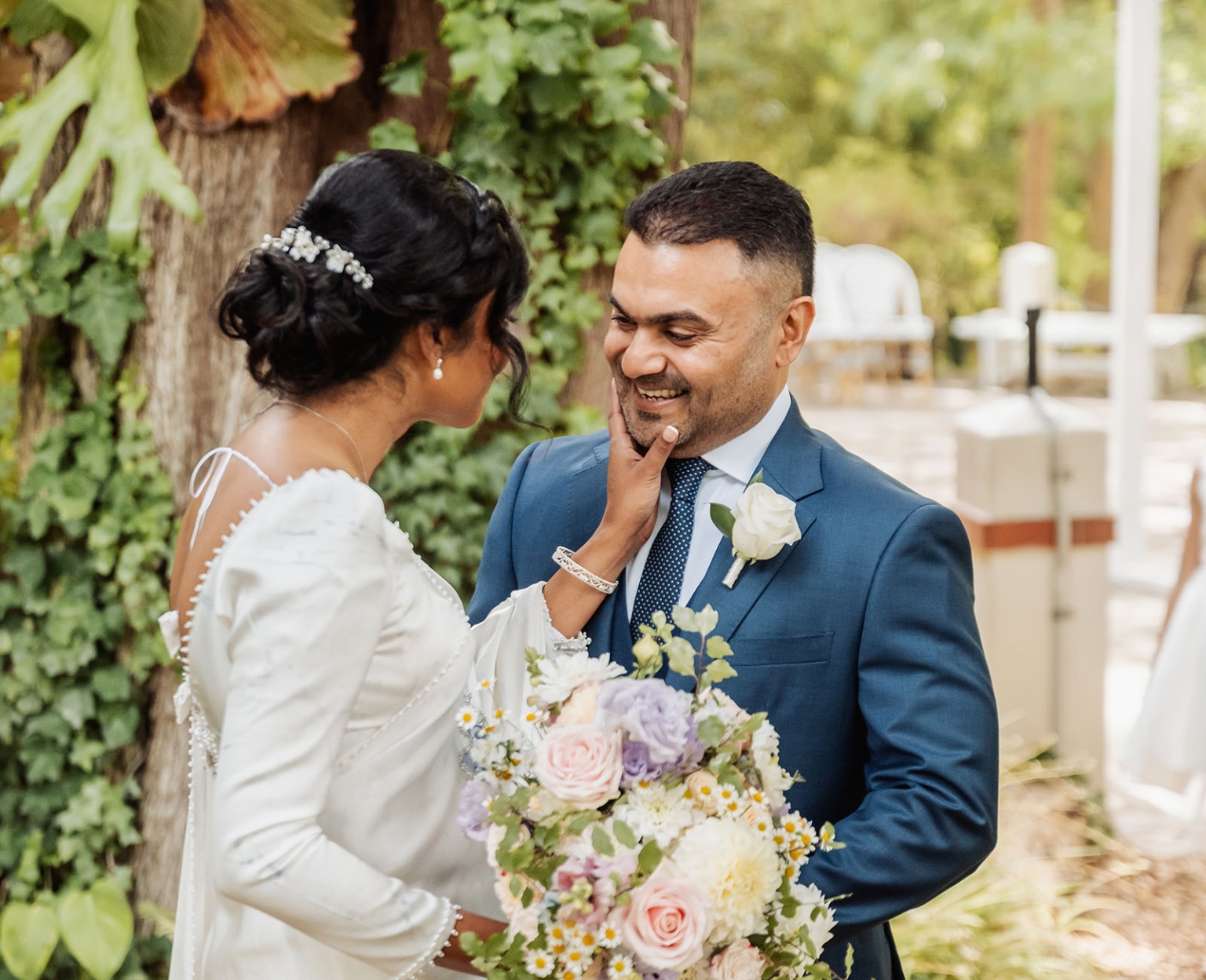 manor wedding in basket range - methmini & aravinda 128 Joyful wedding couple in nature, brides elegant gown, grooms blue suit, romantic bouquet.