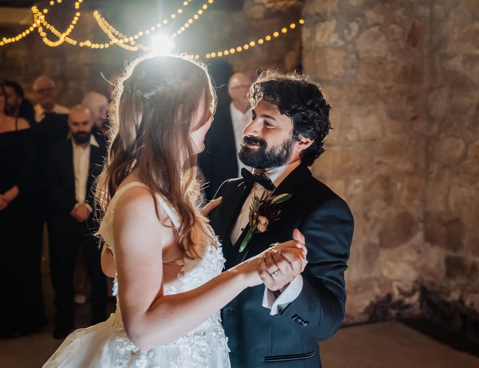beautiful manor basket range wedding - sophie & theodore 144 Bride and groom share romantic first dance under twinkling wedding lights.