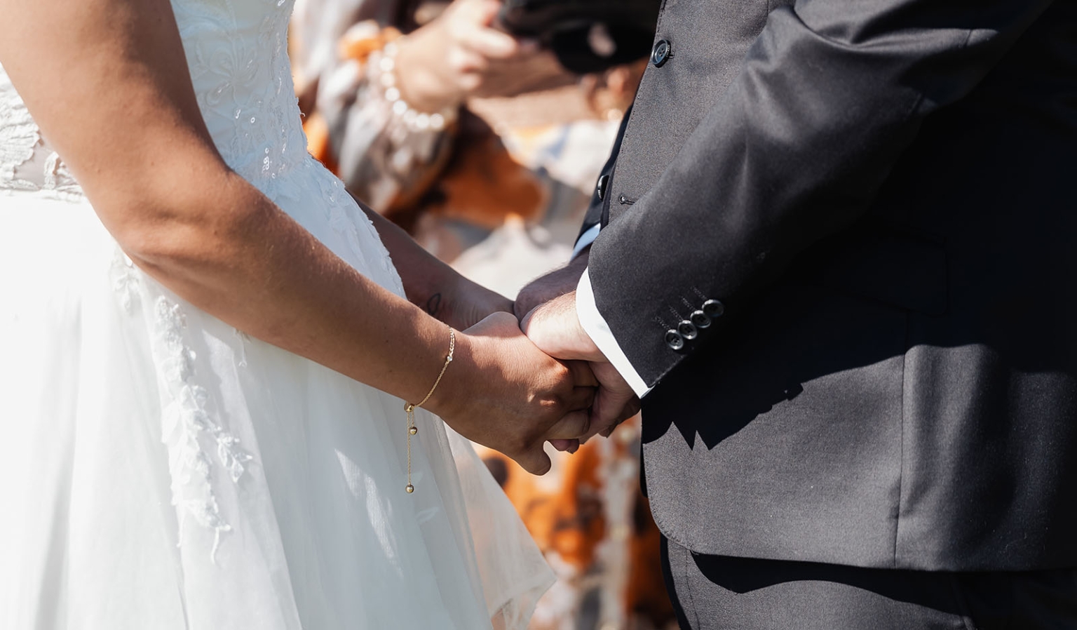 lloyd brothers wedding - dajana & tom 14 Bride and groom holding hands during wedding ceremony, symbolizing love and unity.