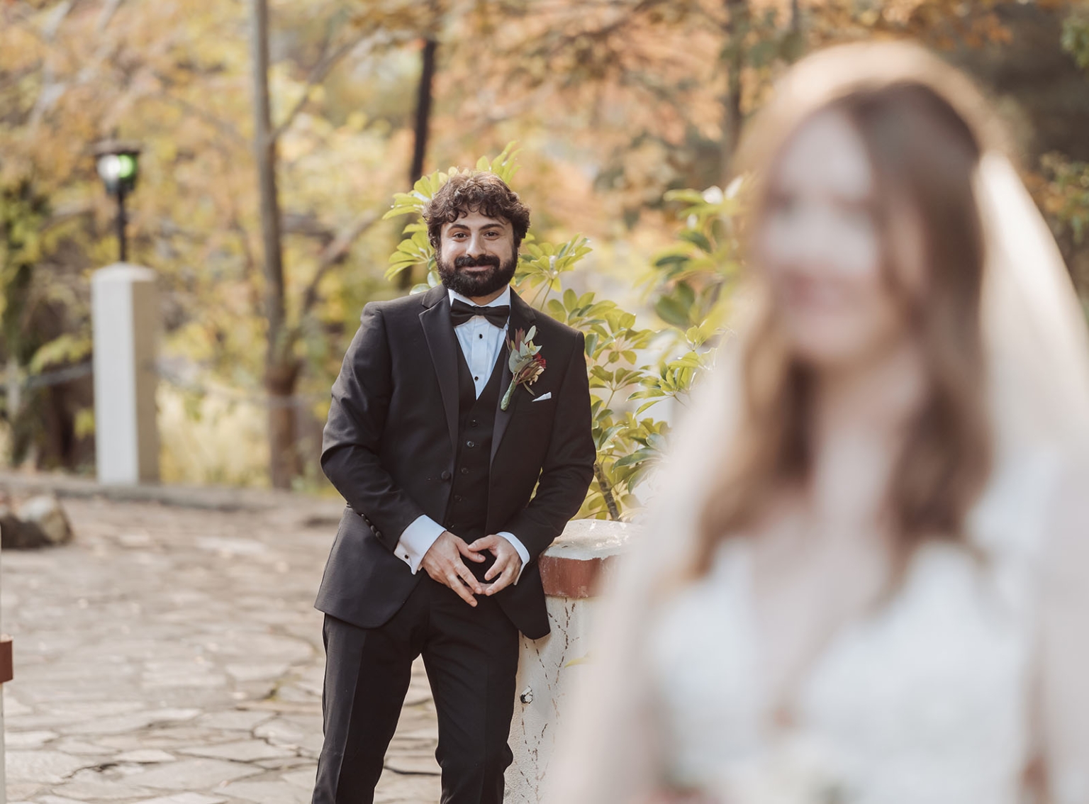 beautiful manor basket range wedding - sophie & theodore 117 Bride in white and groom in black suit in romantic outdoor wedding scene.