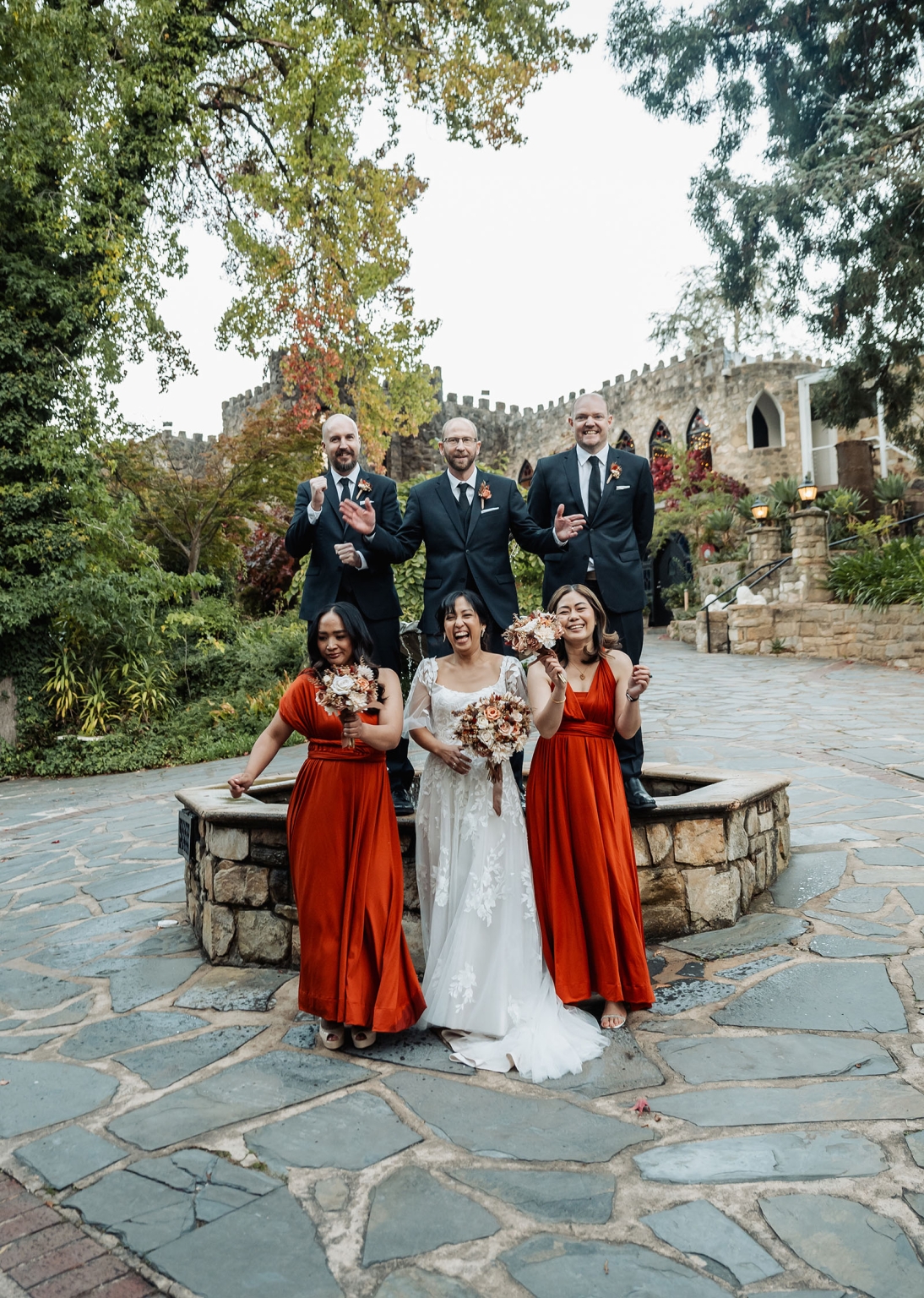 adelaide hills wedding at the manor - jo & dan 43 Wedding party in garden courtyard at romantic castle venue.