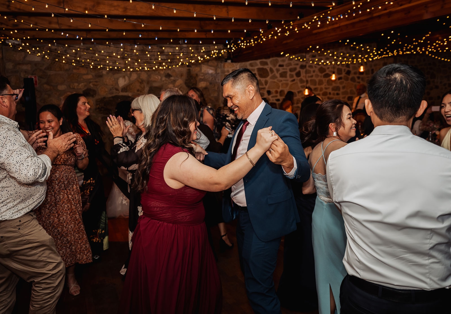 adelaide hills wedding at the manor - jo & dan 67 Wedding reception dance floor with couple dancing under rustic string lights.