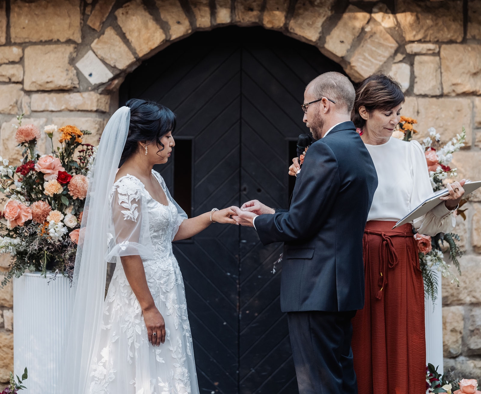 adelaide hills wedding at the manor - jo & dan 28 Bride and groom exchange wedding rings at rustic stone wedding venue.
