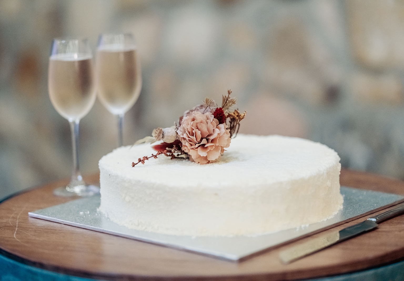 adelaide hills wedding at the manor - jo & dan 58 White floral celebration cake with dried flowers and champagne flutes.