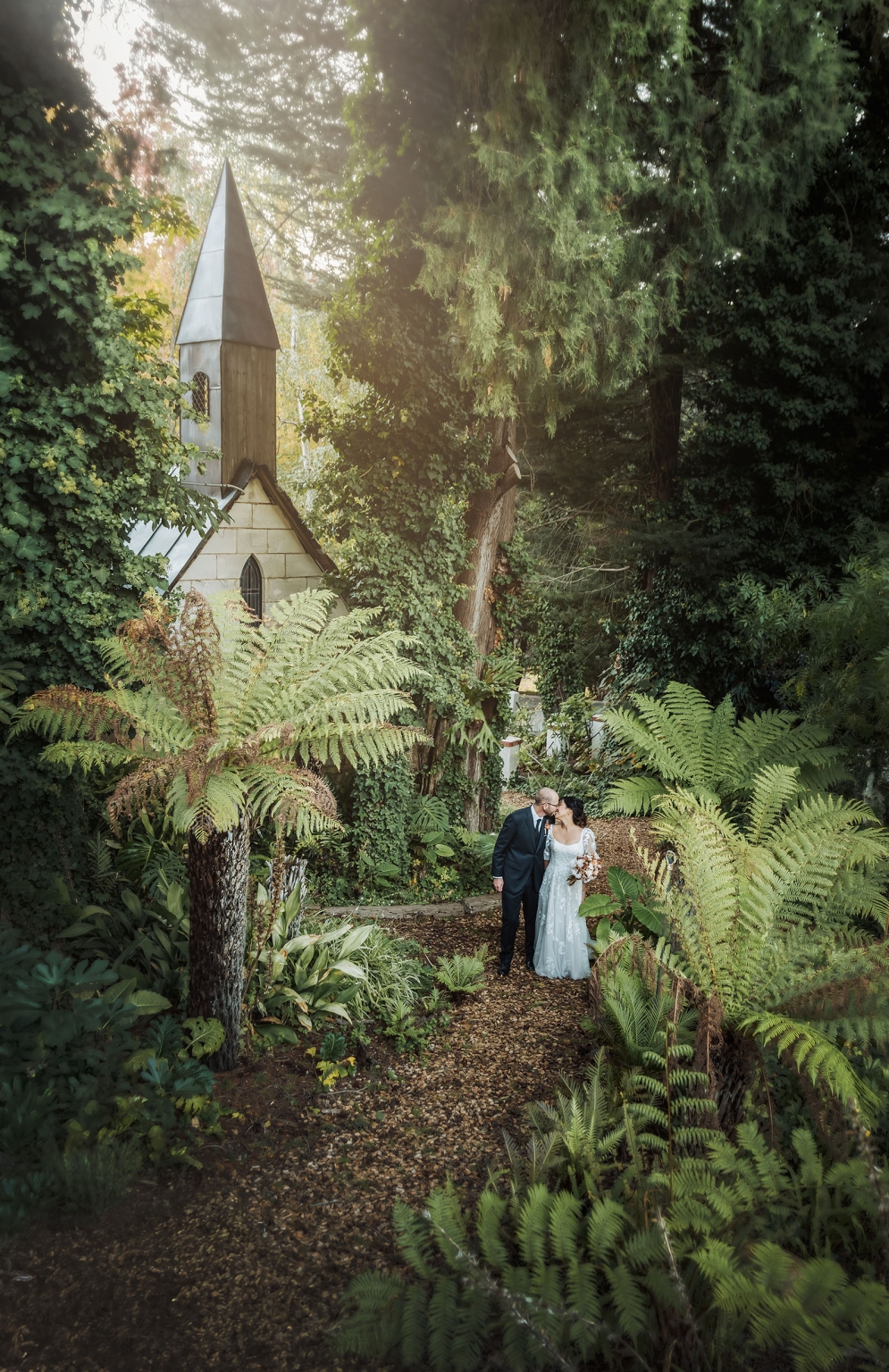 adelaide hills wedding at the manor - jo & dan 34 Woodland wedding couple beside hidden chapel in lush enchanted forest garden.