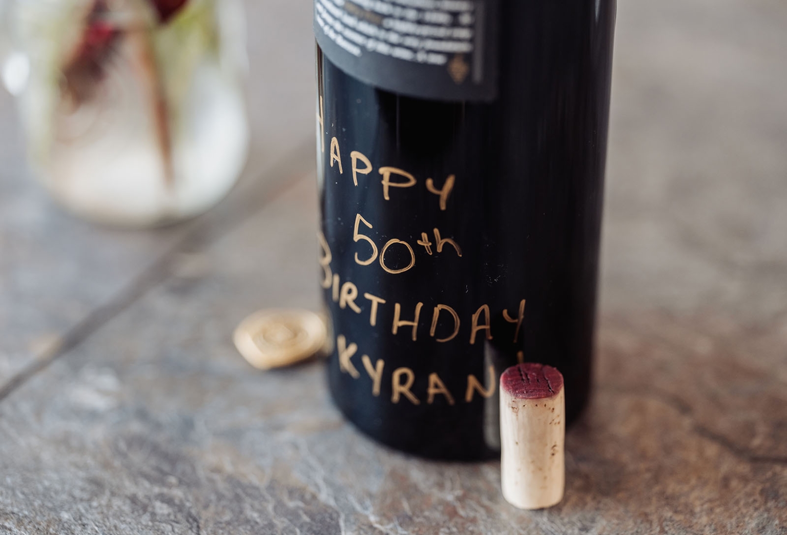 sa marriage office wedding – melissa & kyran 213 Personalized wine bottle with gold Happy 50th Birthday message and red wine cork.