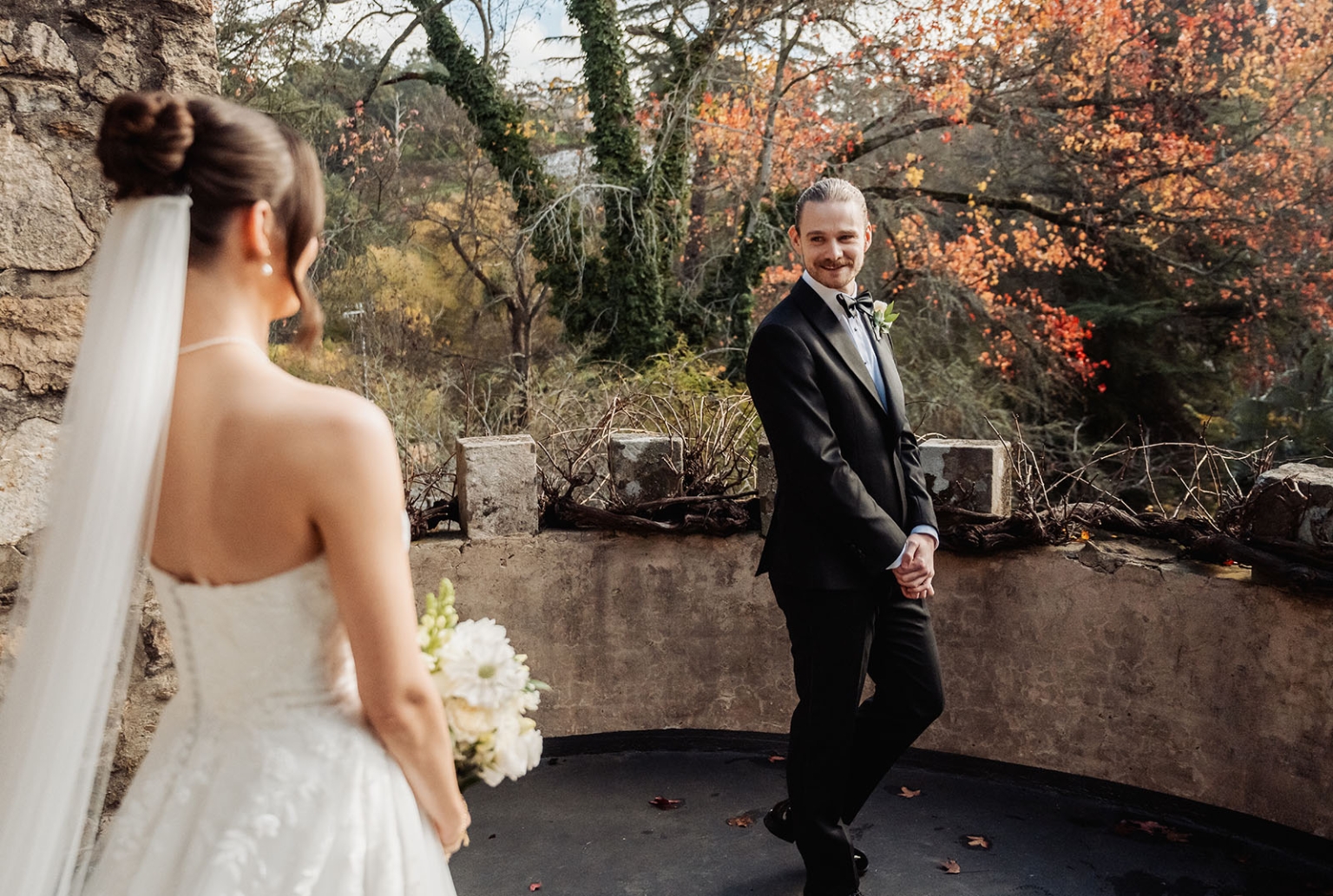 the manor wedding - crystal & mackenzie 39 Autumn wedding first look with bride and groom in rustic stone garden.