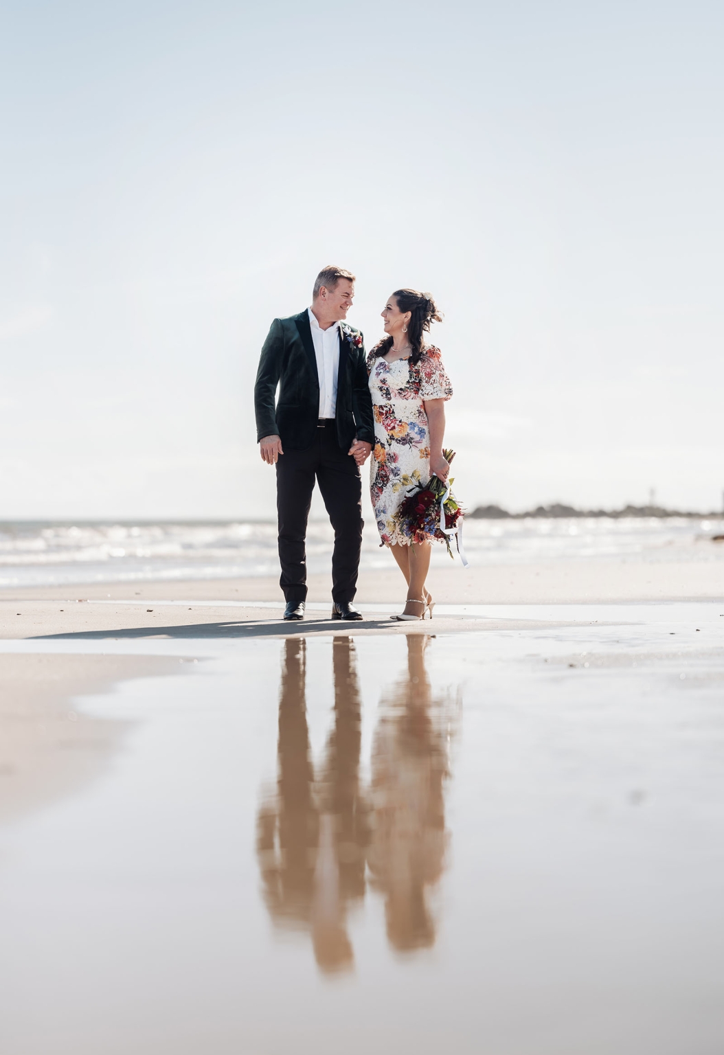 sa marriage office wedding – melissa & kyran 222 Beach wedding couple portrait on wet sand with ocean reflection.