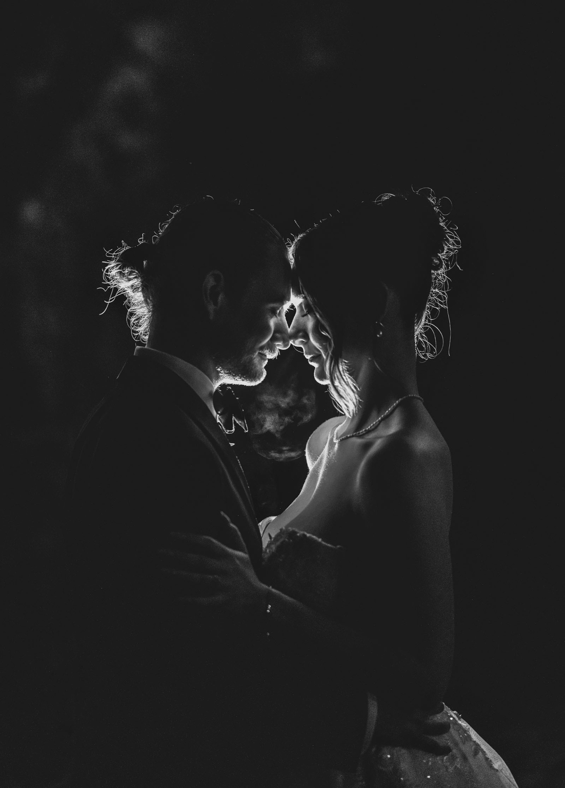 the manor wedding - crystal & mackenzie 96 Black and white wedding couple portrait touching foreheads in romantic silhouette.
