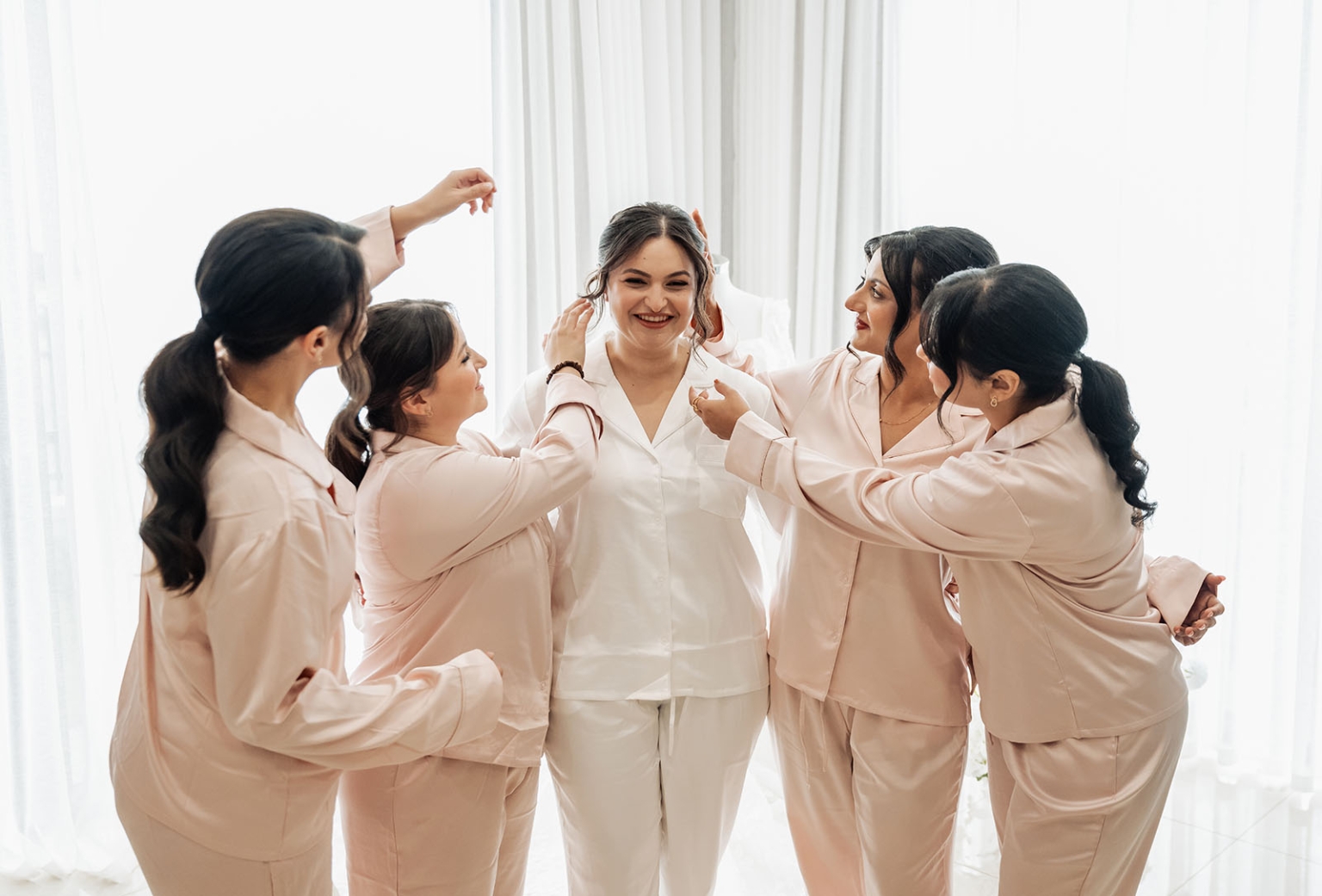 st george & st shenouda coptic church wedding - carmina & bill 22 Bride and bridesmaids in satin pajamas getting ready before wedding.
