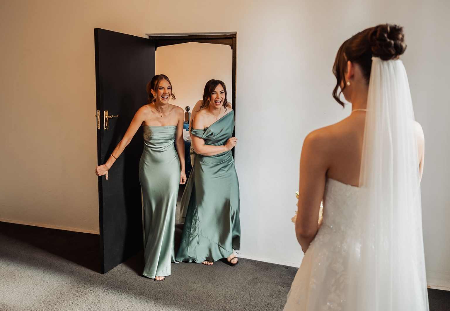 the manor wedding - crystal & mackenzie 28 Bride reveals wedding dress to joyful bridesmaids during emotional first look.