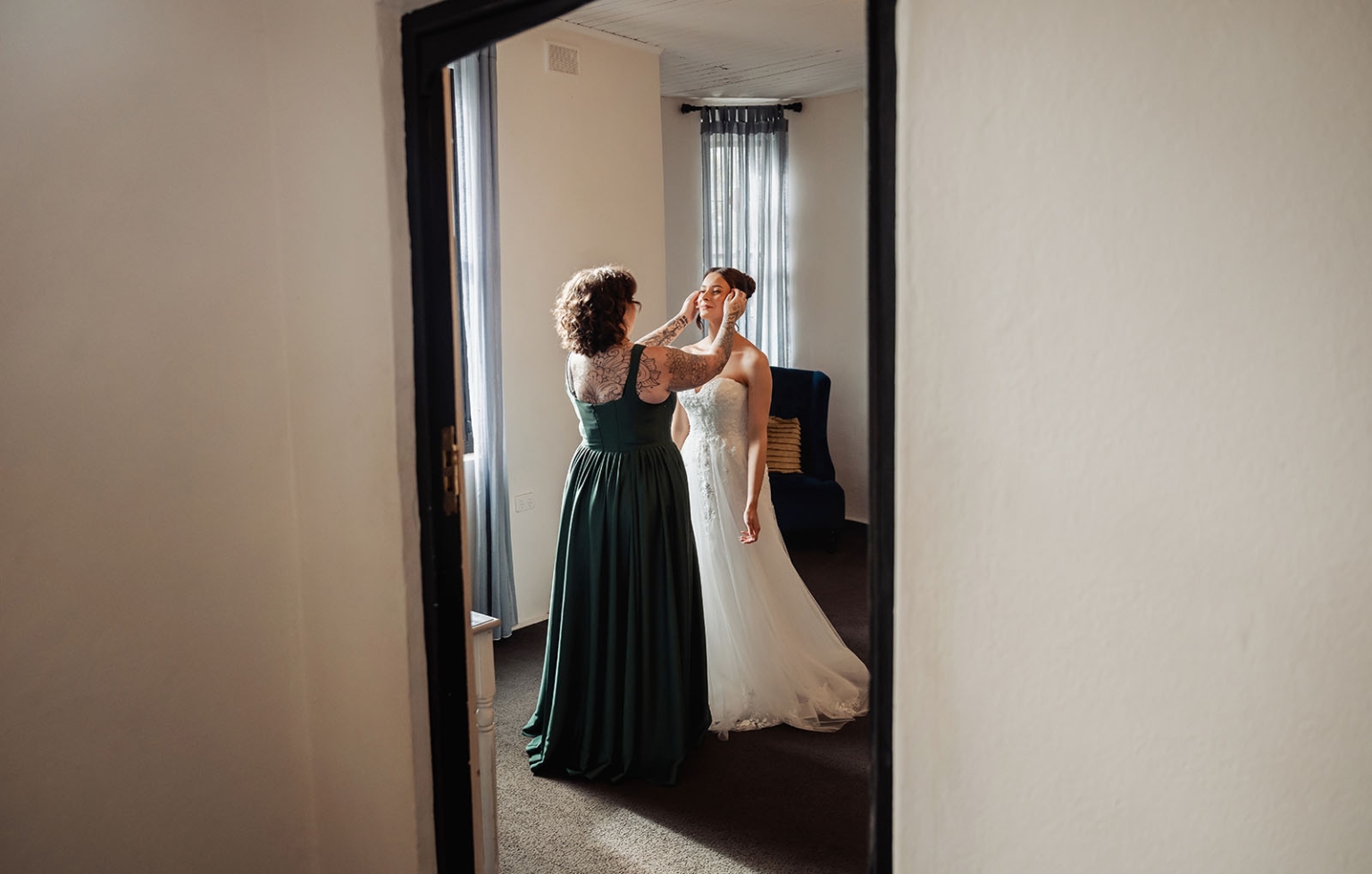 the manor wedding - crystal & mackenzie 17 Bride getting wedding makeup done in white gown before ceremony.