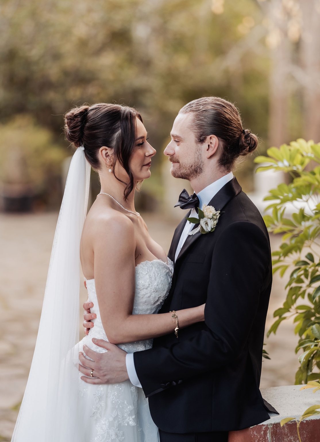 the manor wedding - crystal & mackenzie 69 Bride and groom sharing an intimate outdoor wedding portrait.