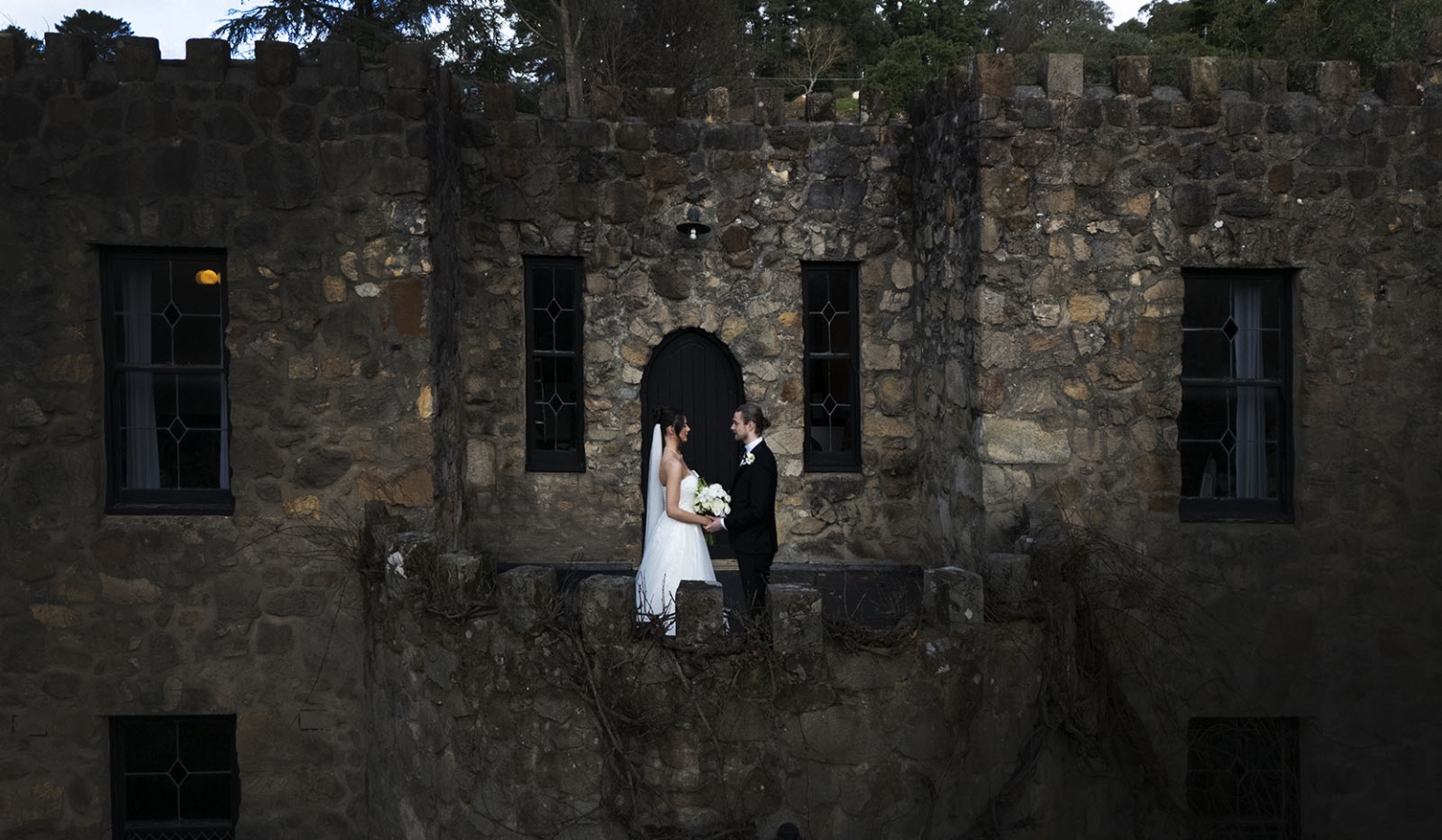 the manor wedding - crystal & mackenzie 62 Bride and groom wedding portrait on rustic castle balcony.