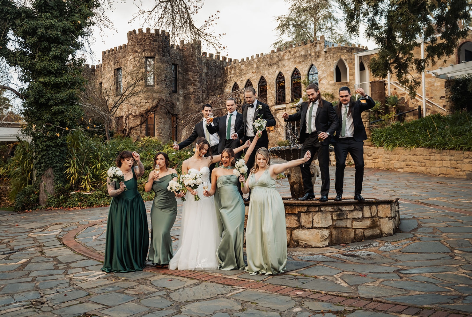 the manor wedding - crystal & mackenzie 72 Castle wedding party with bride, bridesmaids, and groomsmen at historic stone venue.