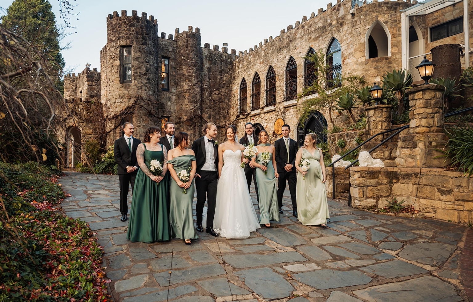 the manor wedding - crystal & mackenzie 74 Elegant castle wedding party portrait with bride, groom, bridesmaids, and groomsmen.