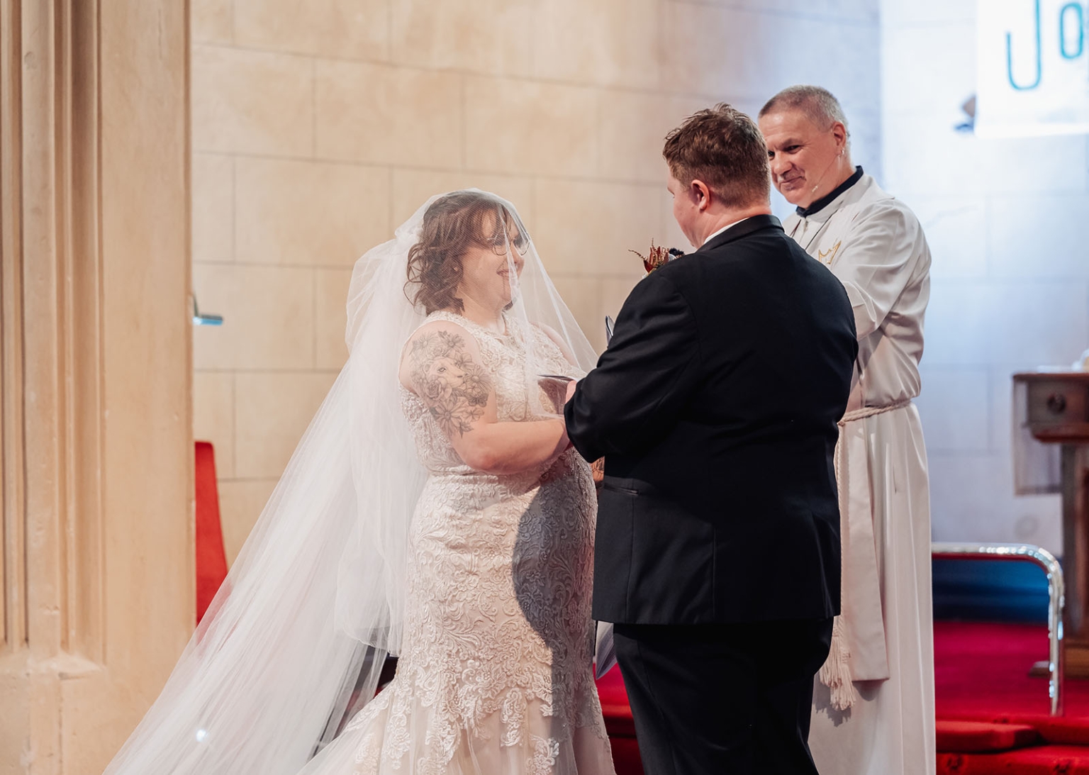 loxton's st peter's church wedding - madeline & brayden 34 Bride and groom exchange vows during a romantic church wedding ceremony.