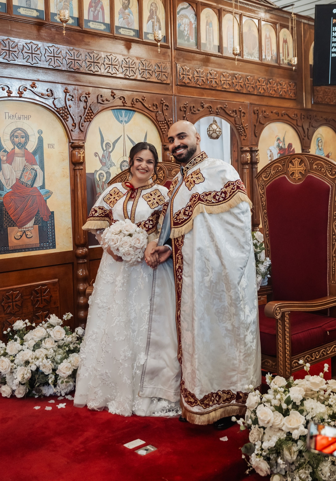 st george & st shenouda coptic church wedding - carmina & bill 42 Orthodox church wedding couple holding hands in ornate ceremony setting.