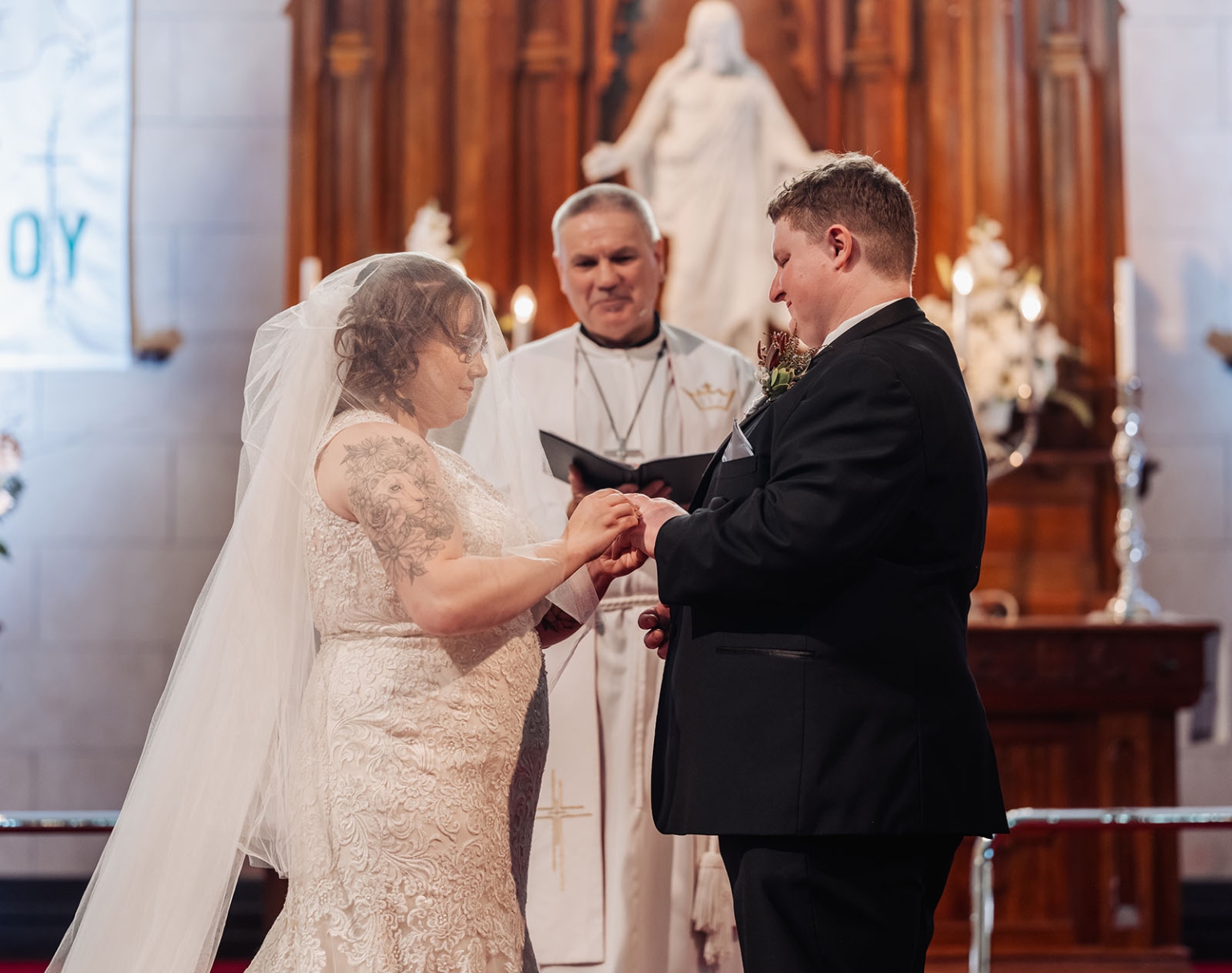 loxton's st peter's church wedding - madeline & brayden 36 Bride and groom exchange wedding rings during a traditional church ceremony.