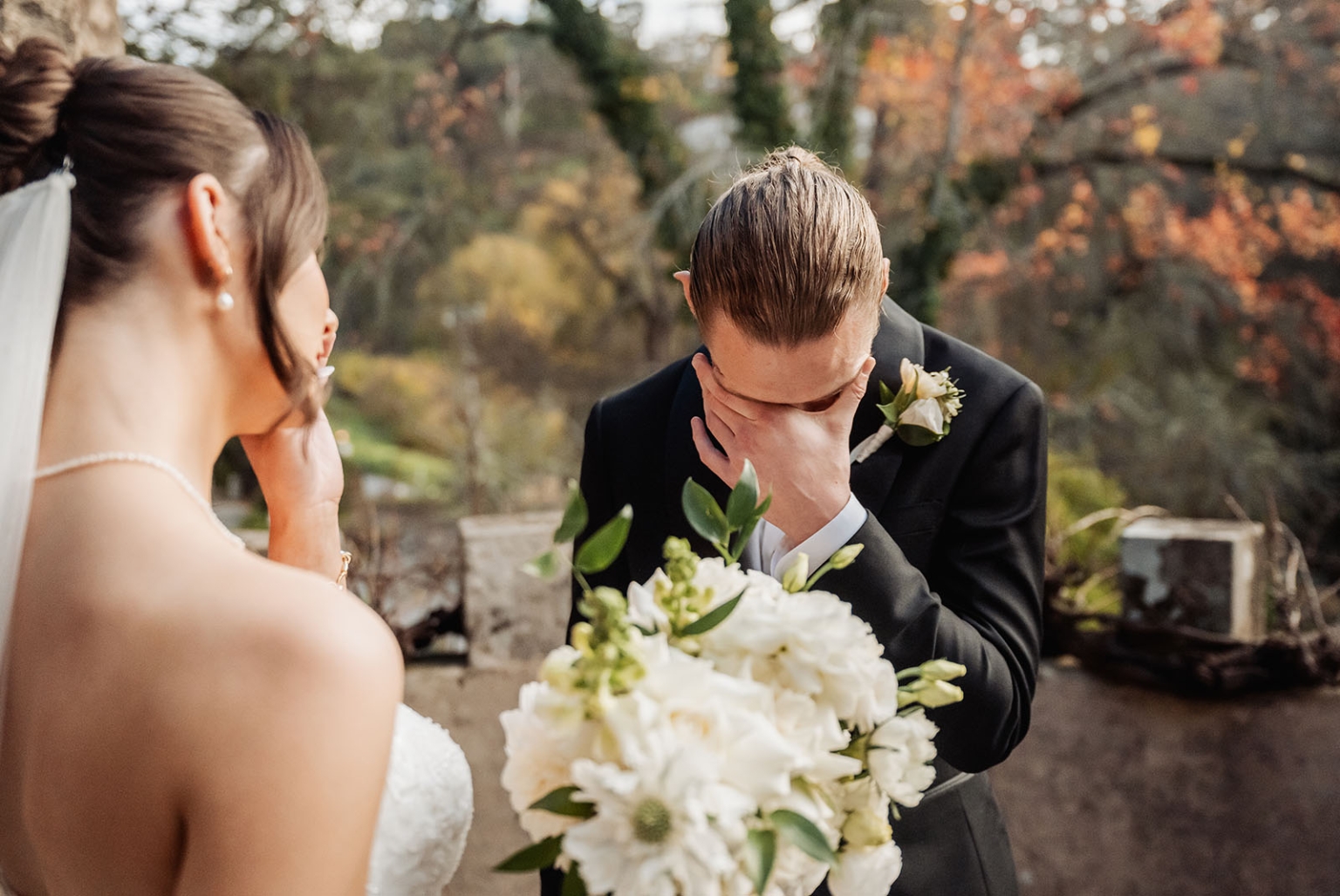 the manor wedding - crystal & mackenzie 41 Emotional wedding first look with bride, groom, and white bridal bouquet.