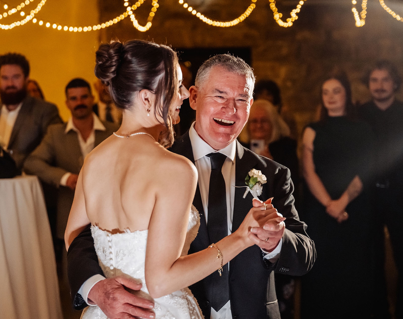 the manor wedding - crystal & mackenzie 91 Bride shares father-daughter wedding dance under warm reception lights.