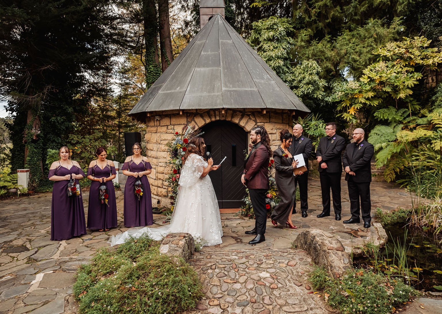 basket range wedding at the manor - leah & wes 50 Rustic garden wedding ceremony at stone chapel with bride, groom, and bridal party.