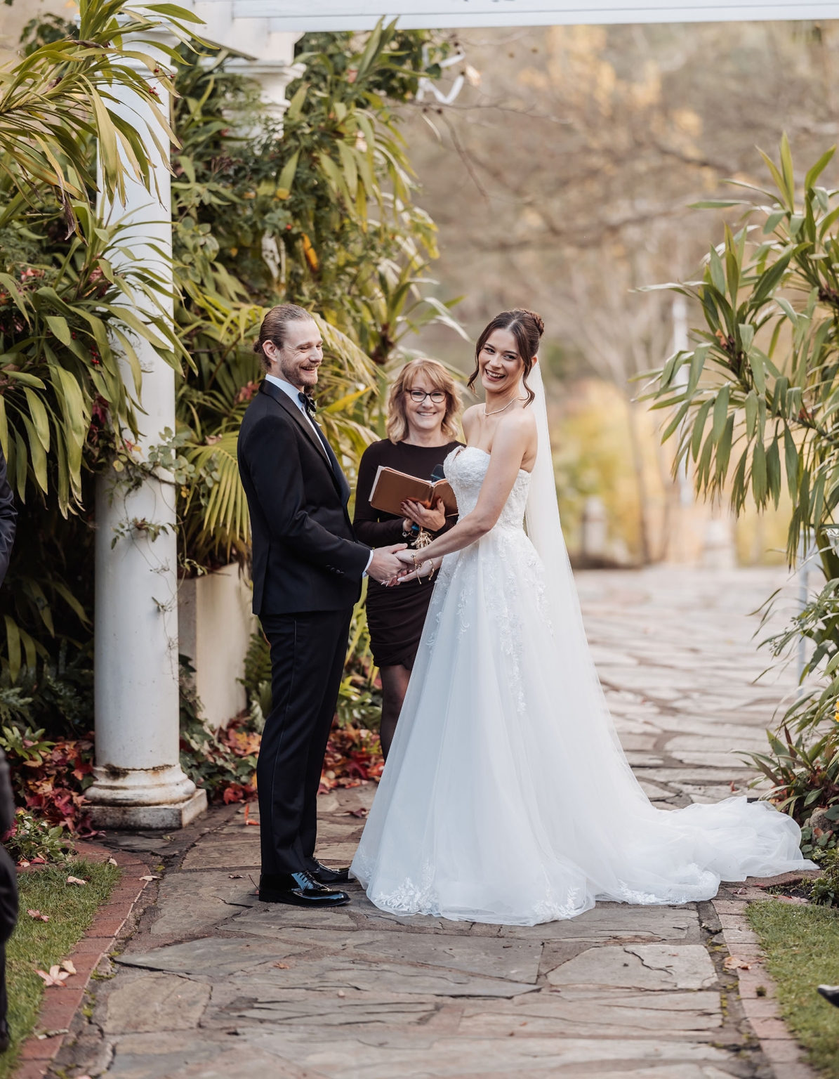 the manor wedding - crystal & mackenzie 53 Bride and groom at romantic outdoor garden wedding ceremony.