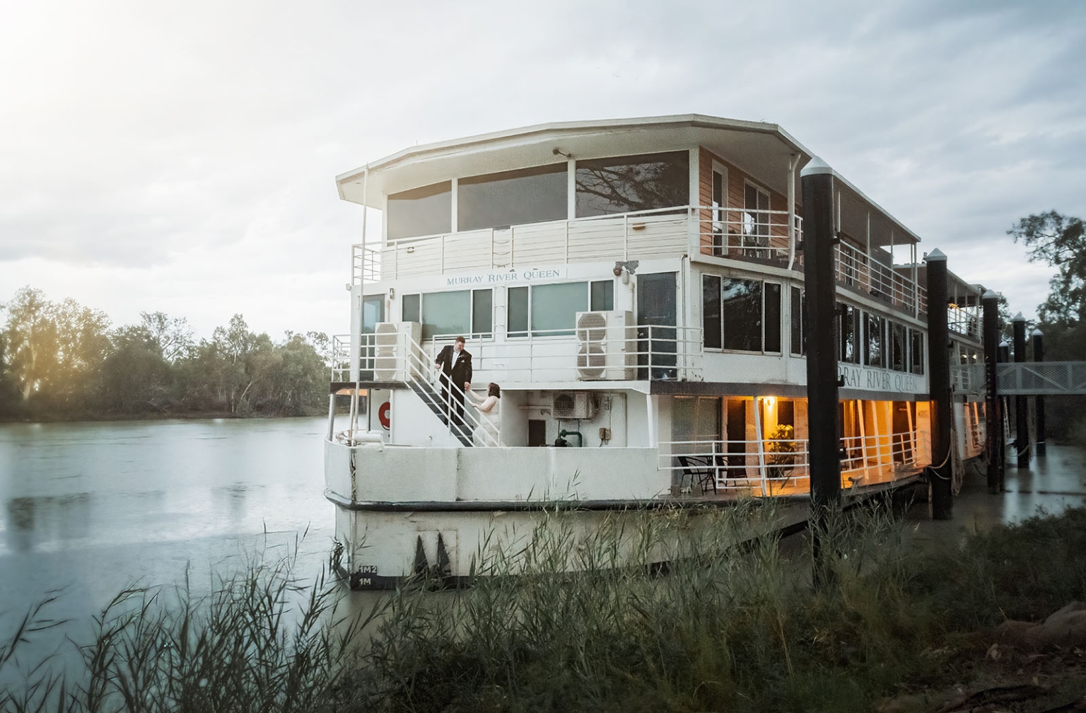 loxton's st peter's church wedding - madeline & brayden 75 Murray River Queen riverboat moored on the Murray River with wedding couple.