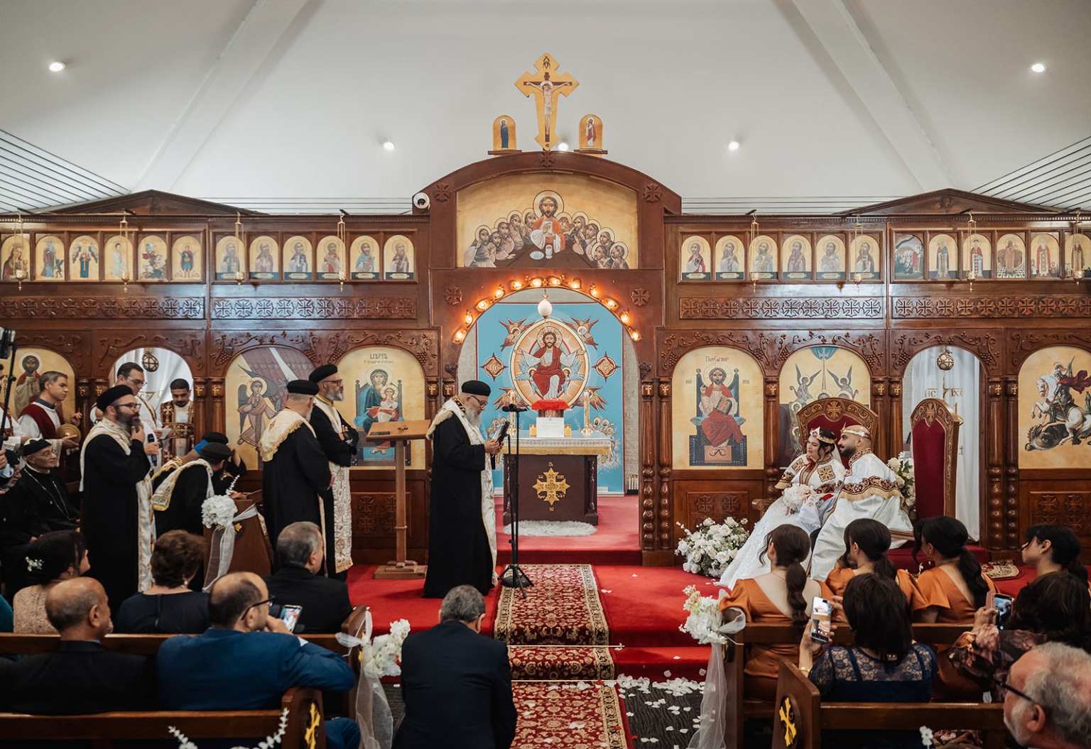 st george & st shenouda coptic church wedding - carmina & bill 48 Orthodox wedding ceremony in ornate icon-filled church with crowned bride and groom.