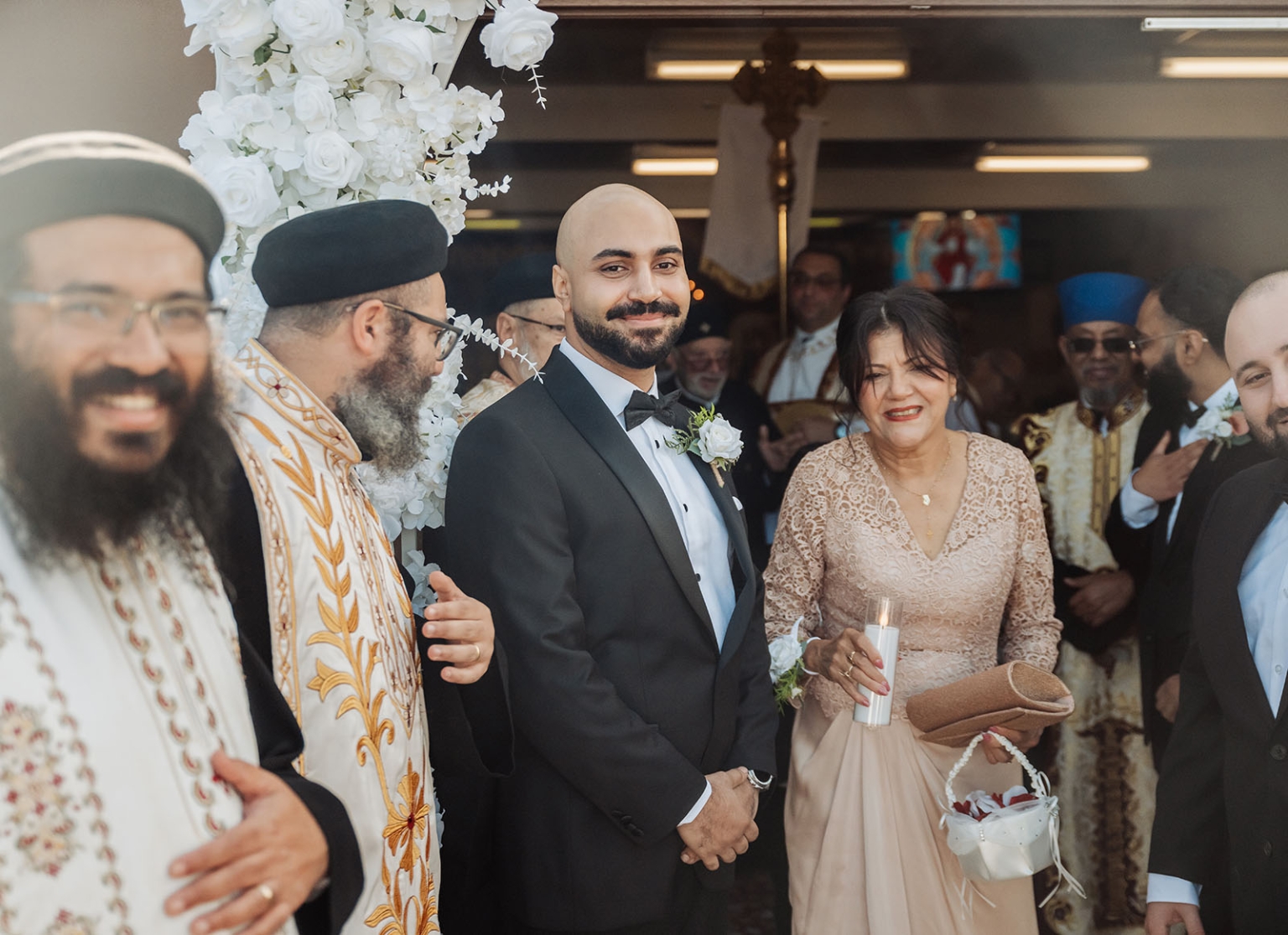 st george & st shenouda coptic church wedding - carmina & bill 35 Orthodox wedding groom with clergy and candle bearer at church ceremony.