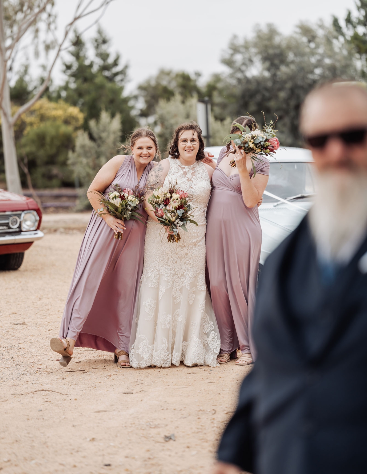 loxton's st peter's church wedding - madeline & brayden 51 Outdoor wedding bride with bridesmaids, bouquets, and vintage cars.