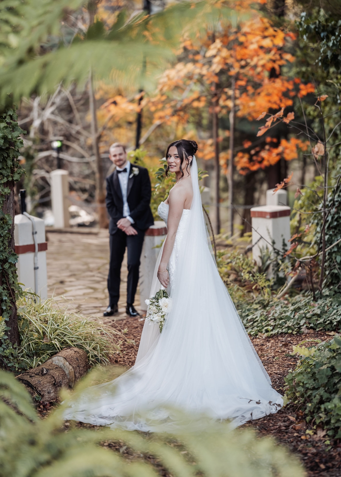 the manor wedding - crystal & mackenzie 68 Autumn outdoor wedding portrait with bride in white gown and groom in tuxedo.