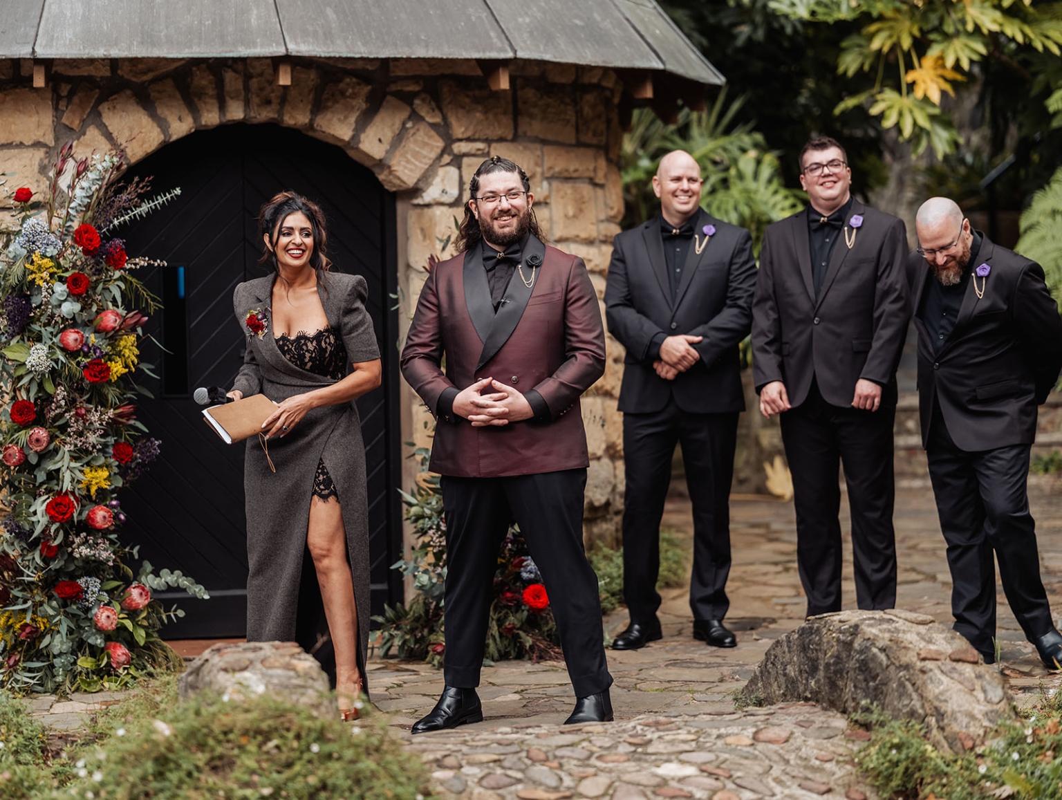 basket range wedding at the manor - leah & wes 42 Gothic wedding party at rustic stone ceremony arch with burgundy groom and florals.