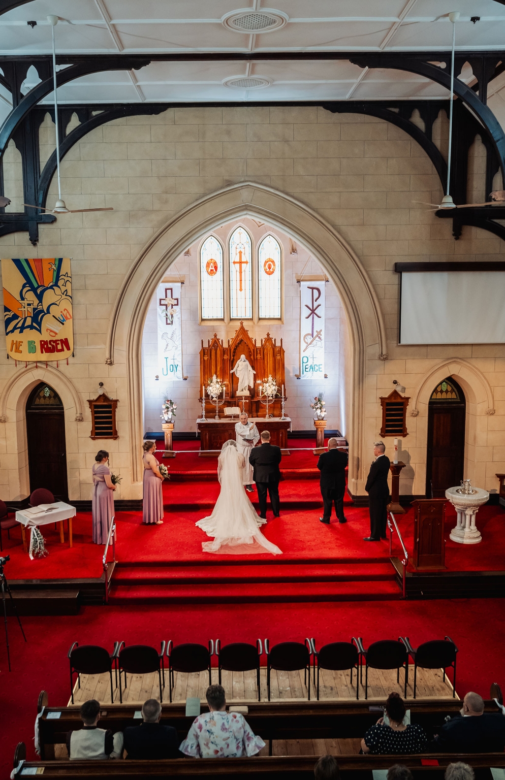 loxton's st peter's church wedding - madeline & brayden 33 Traditional church wedding ceremony with bride and groom at ornate Gothic altar.
