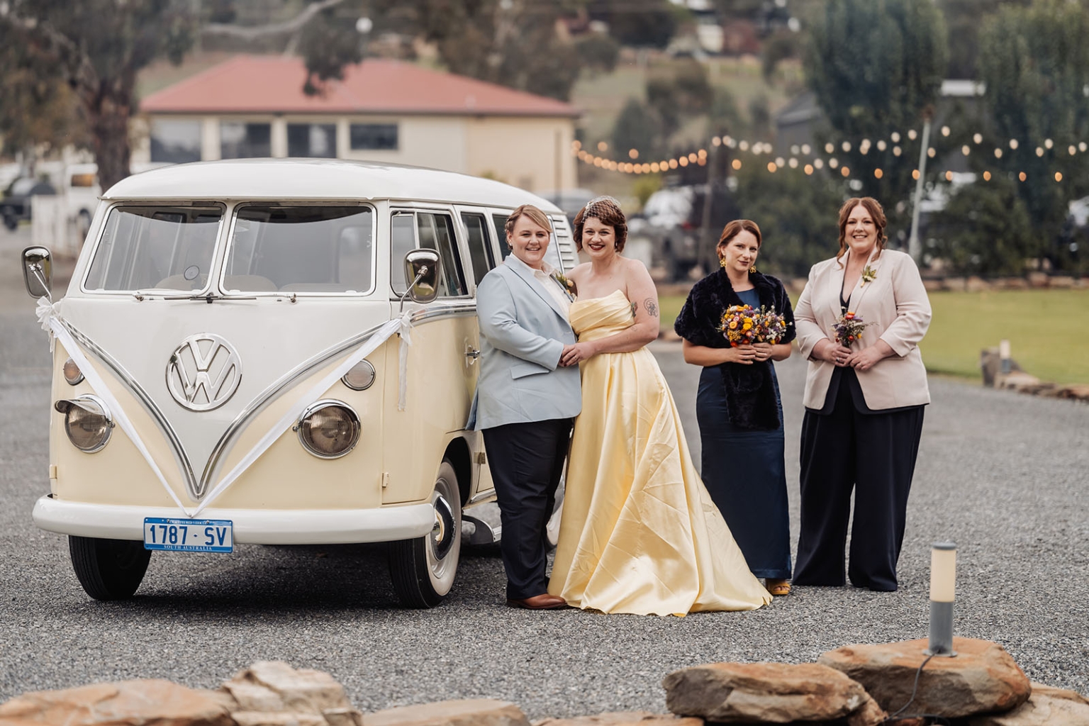 tiny house on the prairie wedding - lauren & bek 19 Vintage VW camper van wedding party with bride, groom, and bridesmaids outdoors.