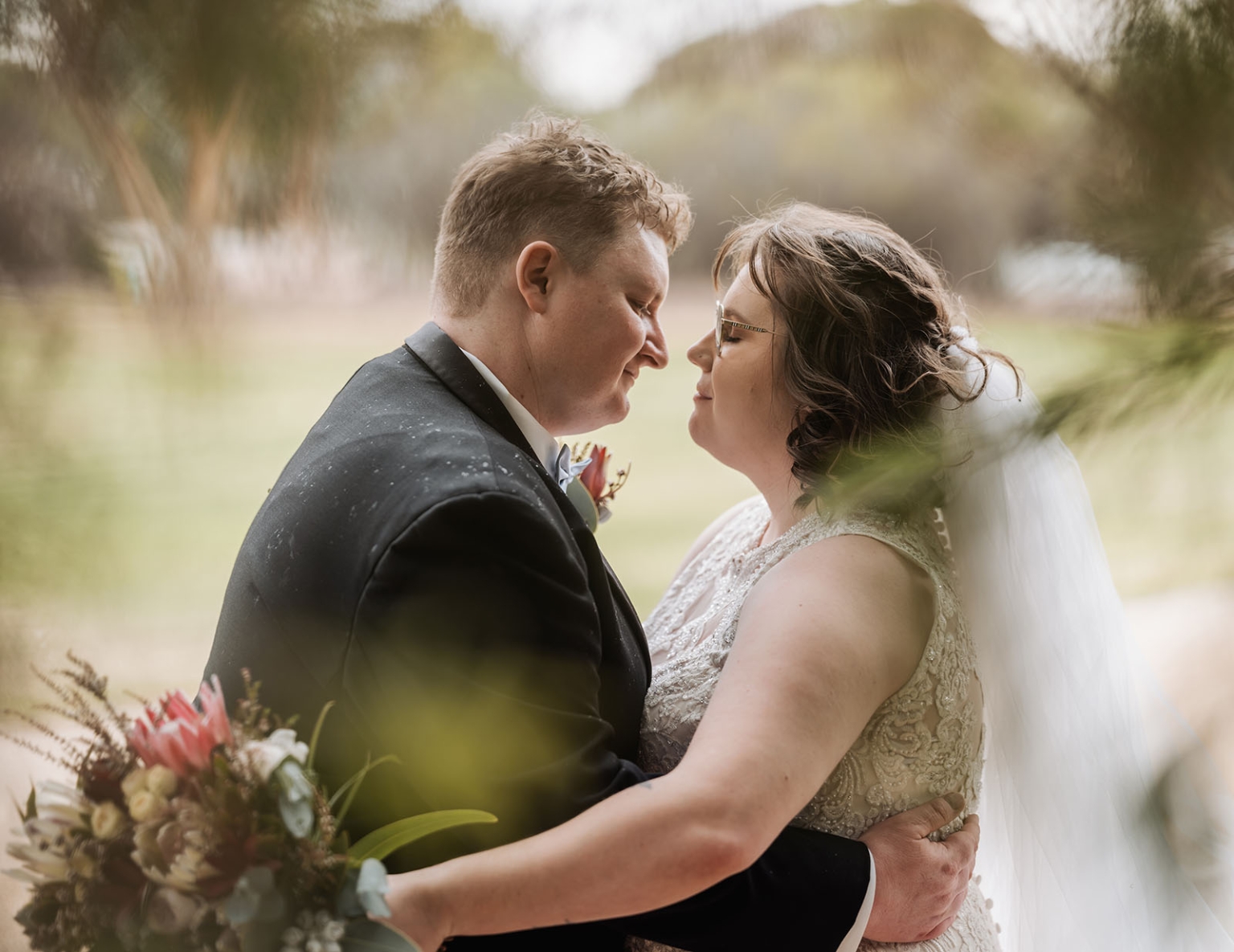 loxton's st peter's church wedding - madeline & brayden 49 Romantic newlywed couple portrait in garden, bride and groom sharing intimate wedding moment.