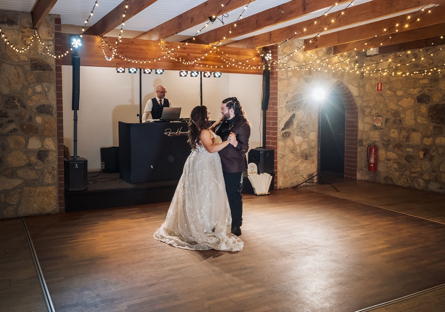 basket range wedding at the manor - leah & wes 72 Bride and groom first dance in rustic wedding reception hall.