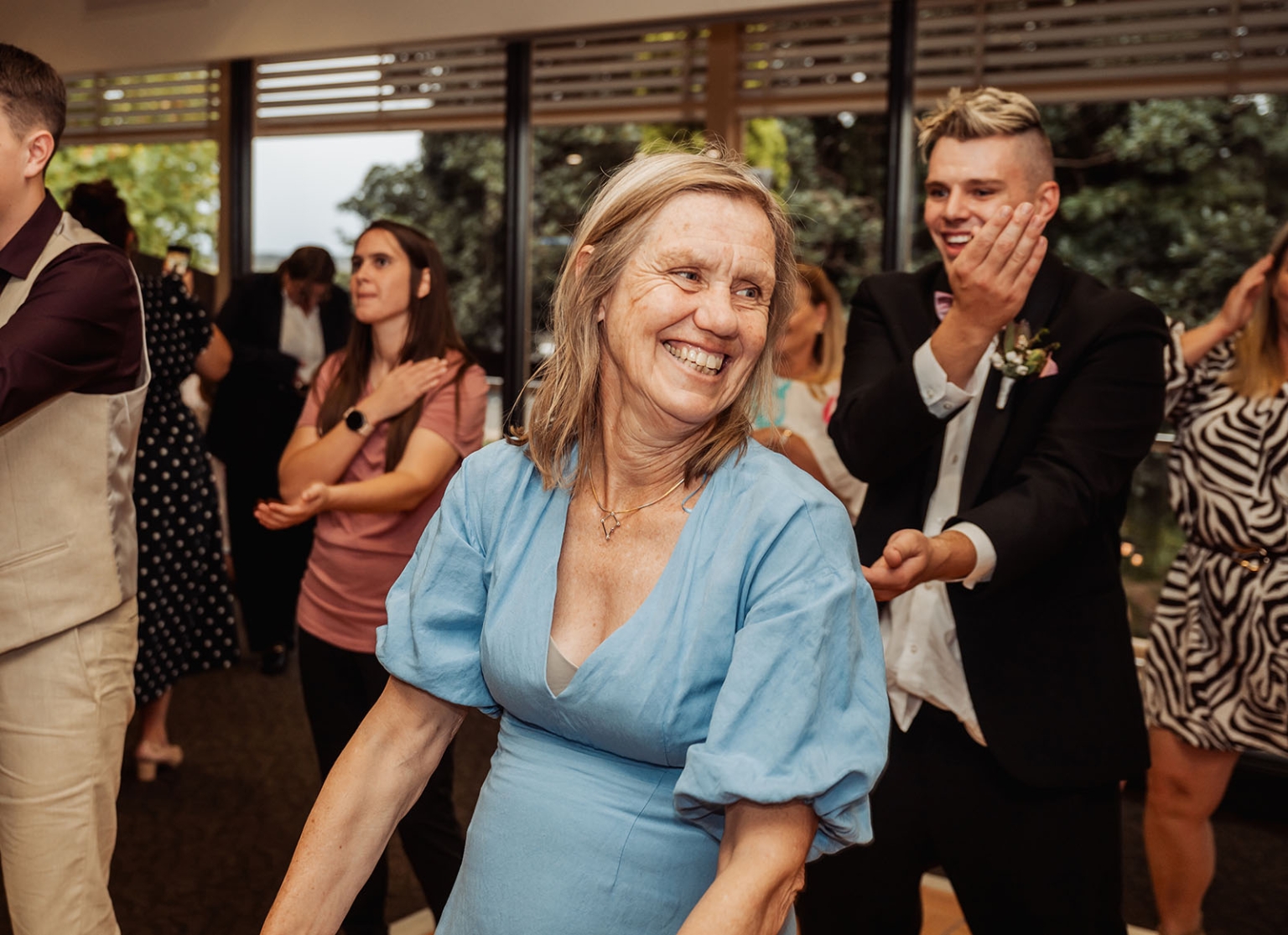 loxton's st peter's church wedding - madeline & brayden 69 Wedding guests dancing and celebrating at a joyful indoor reception.