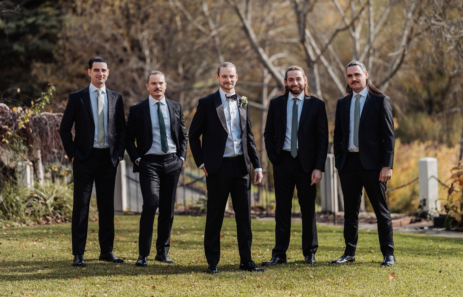 the manor wedding - crystal & mackenzie 10 Groom and groomsmen in black suits posing for outdoor fall wedding portrait.