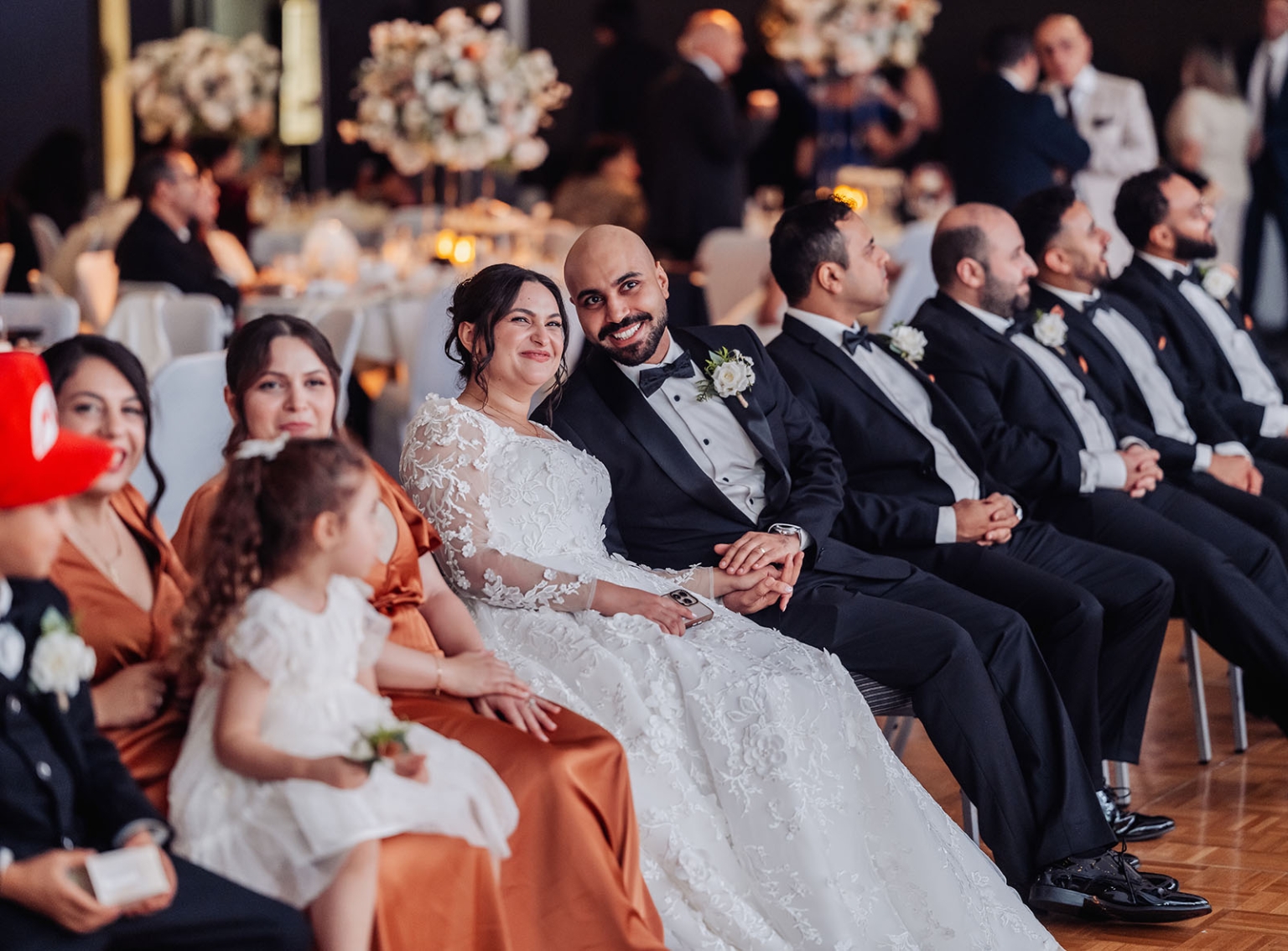 st george & st shenouda coptic church wedding - carmina & bill 91 Bride and groom with wedding party at elegant candlelit reception.