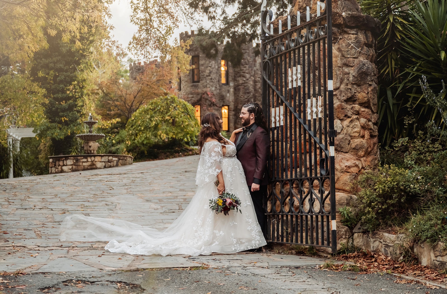 basket range wedding at the manor - leah & wes 60 Romantic wedding portrait of bride and groom by castle garden gate.